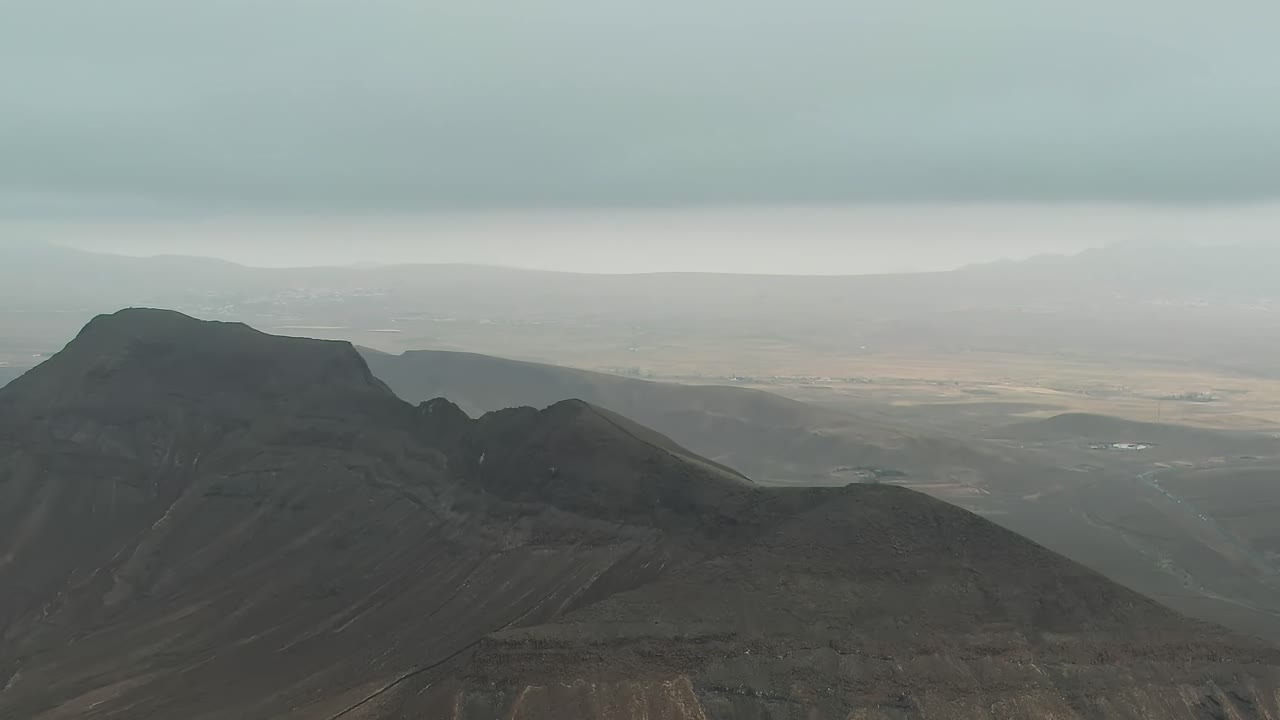 Wide Vista of Volcanic Plains and Distant Hills