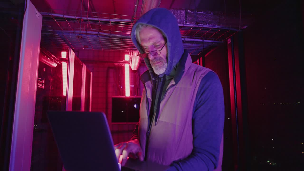 Man working late in a server room