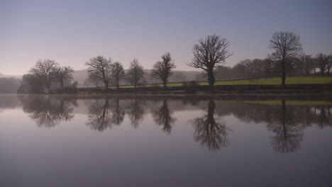 absolutely stunning shot of a glassy lake early in the morning