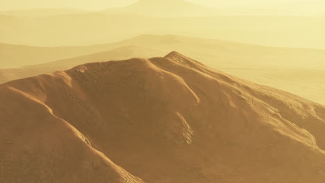 martian desert landscape: arid mountains and hazy sunset