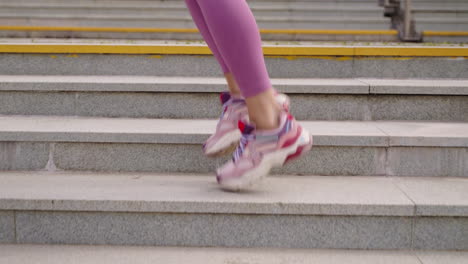 woman running up stairs