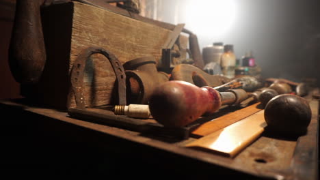 tracking shot of tools on workbench