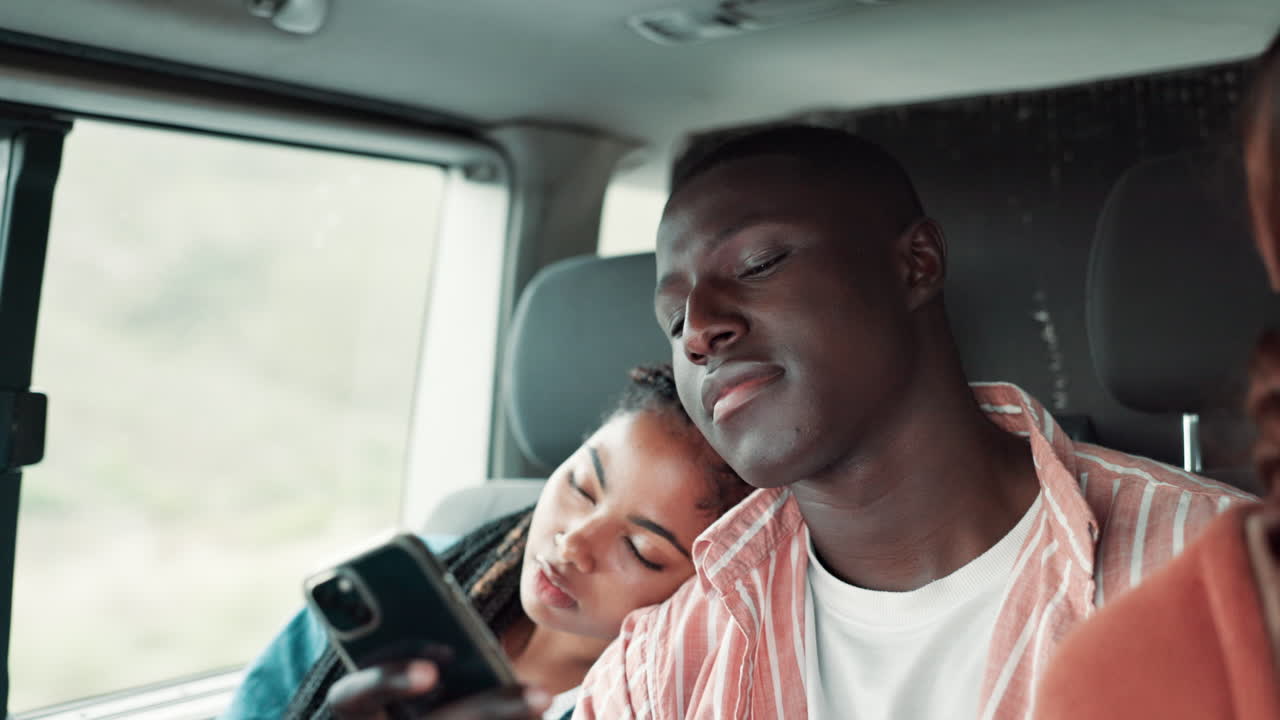Young Couple Sleeping in a Car
