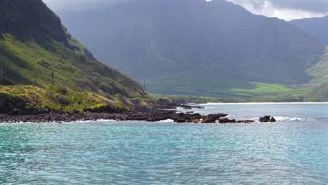 turquoise water and rocky shoreline of the waianae coast in oahu, hawaii