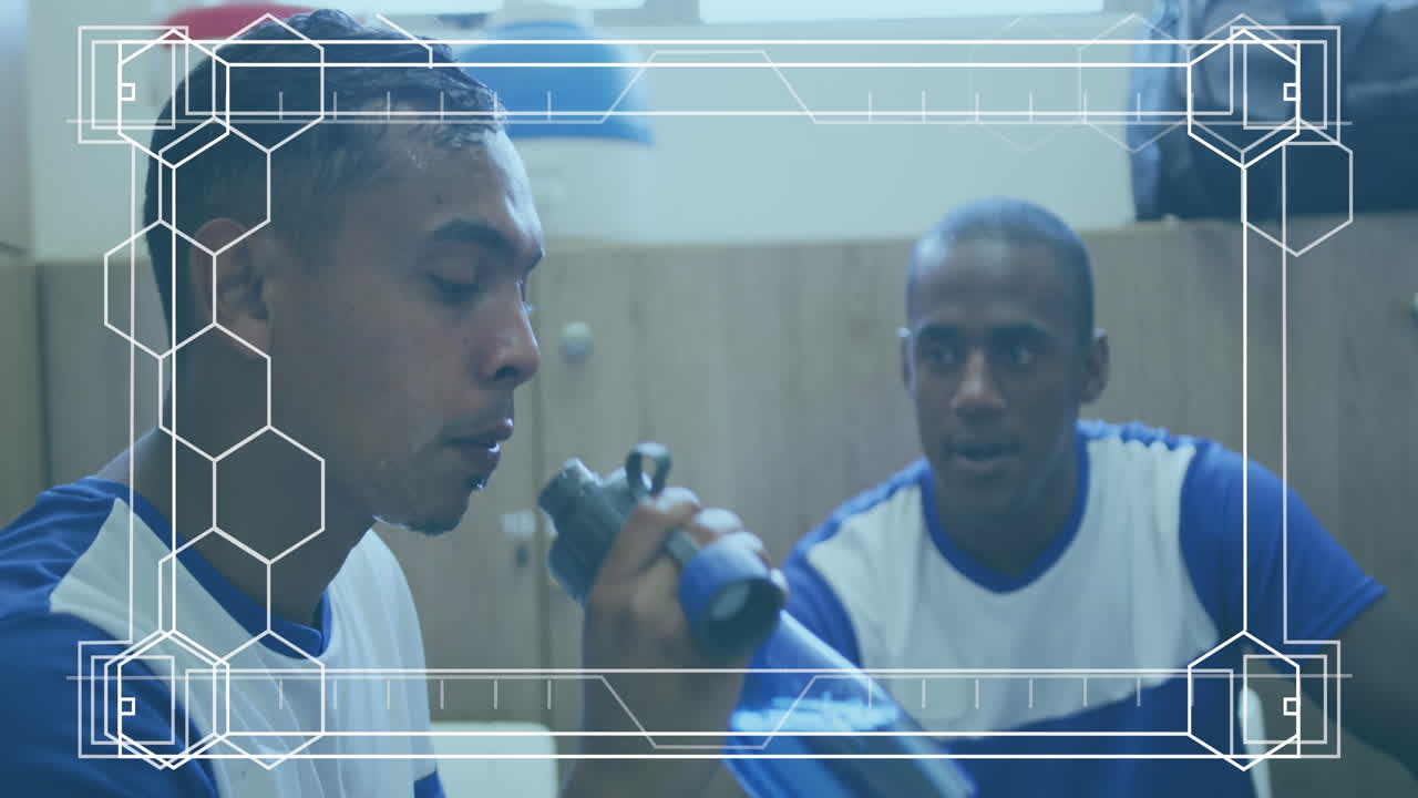 Animation of white frame with markers over football players during break in changing rooms