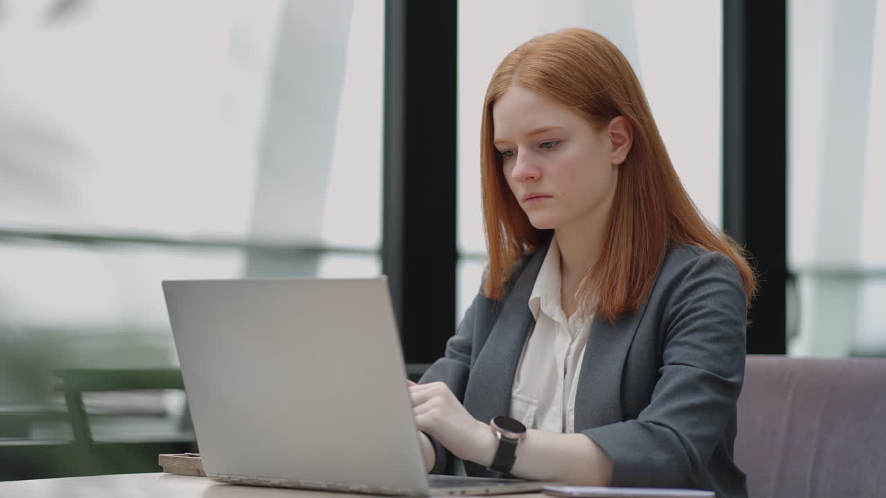 professional lawyer or economist is reading agreement on laptop display working in office