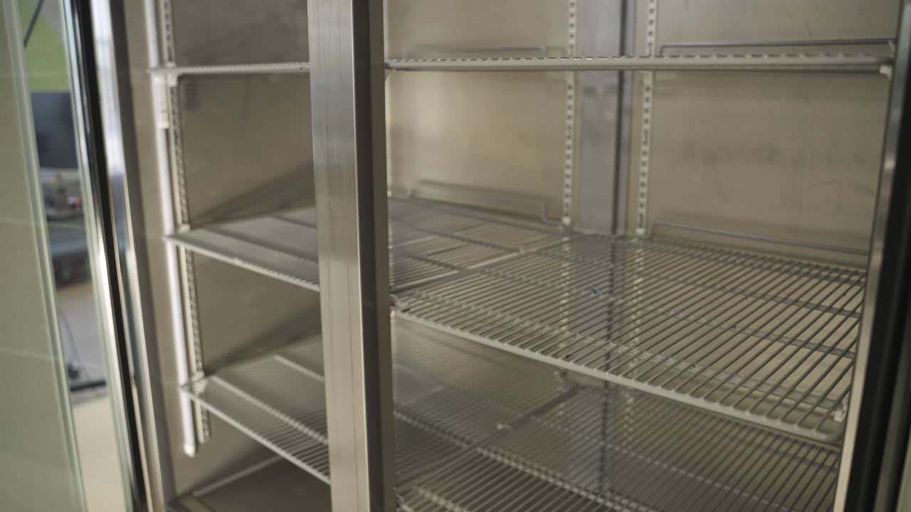 Capturing of empty grocery coolers at a grocery store.