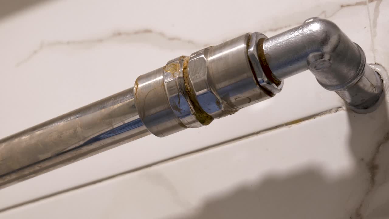 Close-Up of Dripping Water Pipe