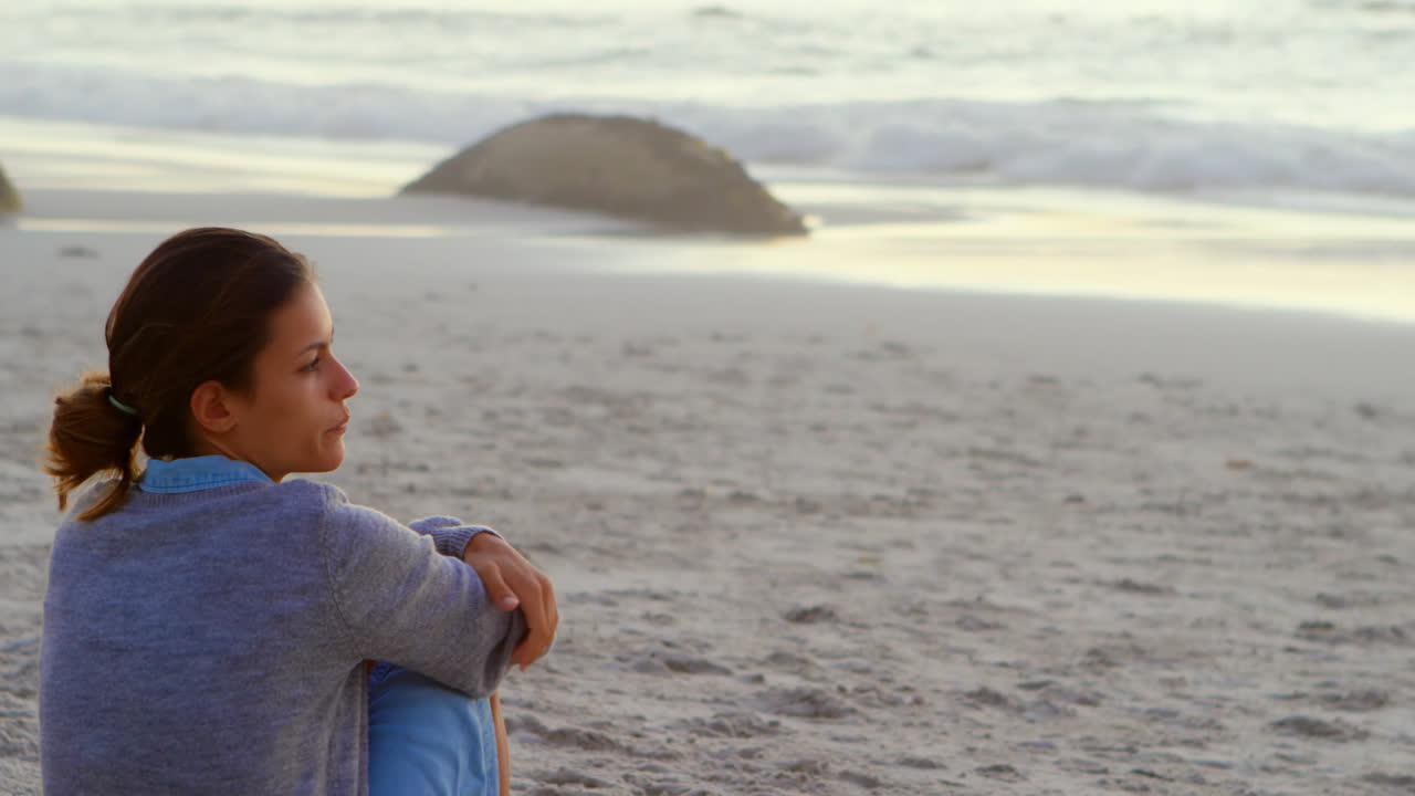 Woman relaxing in the beach 4k