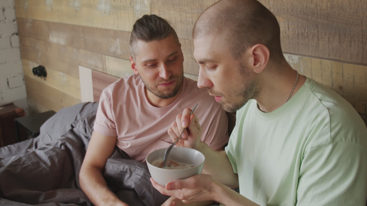 Gay Couple Having Breakfast in Bed