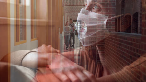 woman in face mask against college students walking in corridor