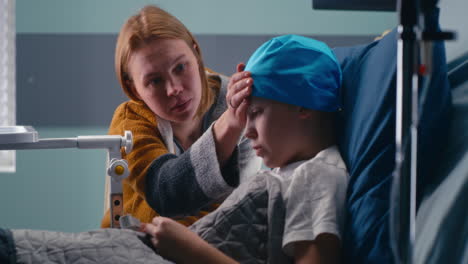 mother comforting child in hospital