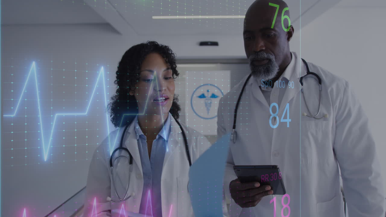 Animation of heart rate monitor against diverse male and female doctors discussing at hospital