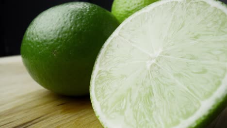 macro video of water drop falling off the lime