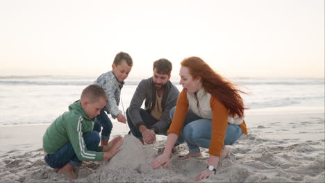 Family,-building-and-castle-of-sand-on-the-beach