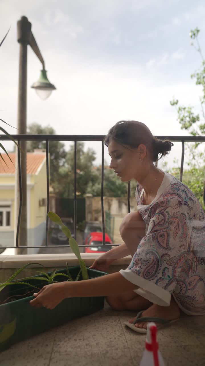 Woman Gardening on Balcony