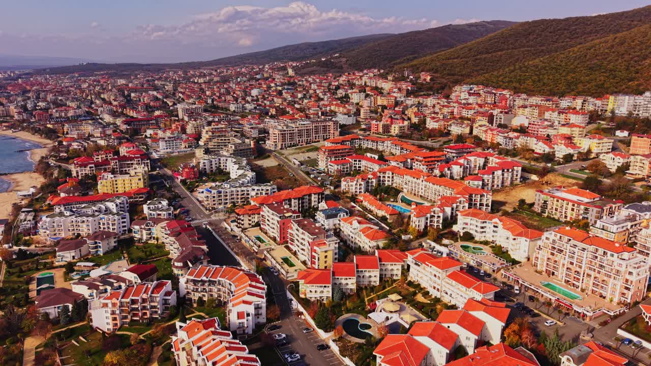 Vibrant aerial view of a coastal town in Bulgaria with lush hills