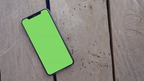 smartphone place on wood background.