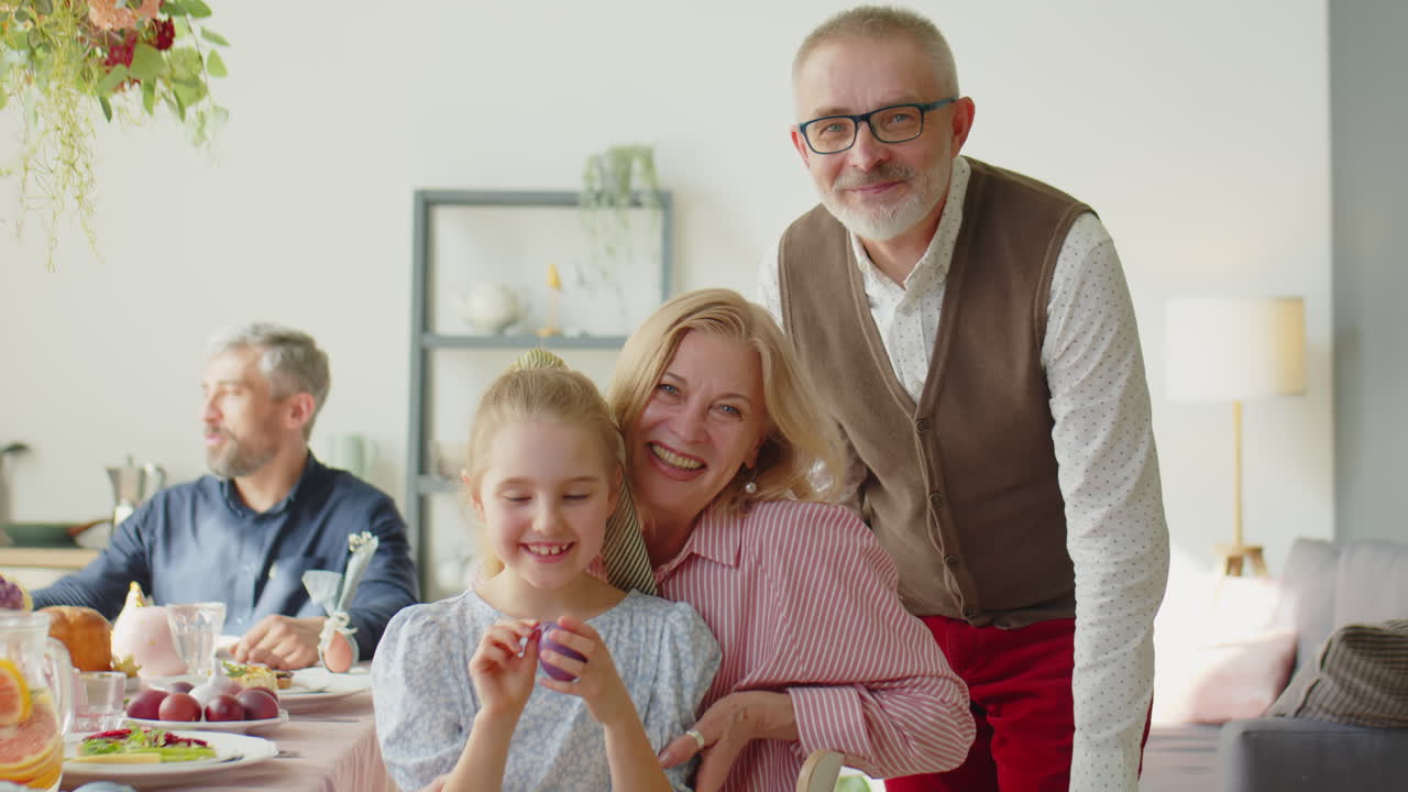 Portrait of Little Girl with Grandparents on Easter Dinner