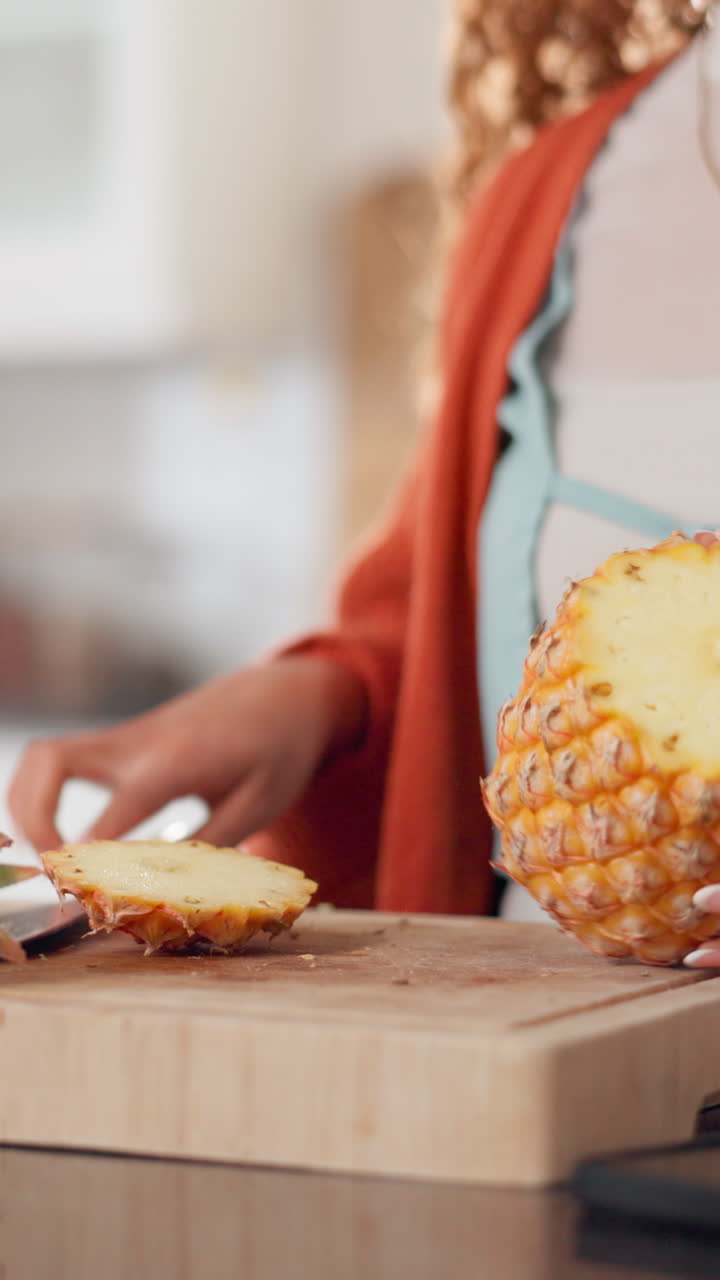 Person Cutting Fresh Pineapple on a Wooden Board