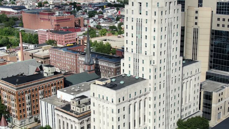 Rising aerial, dramatic skyscrapers, office buildings in downtown urban city, church, apartment, homes, business, government buildings, United States of America USA, cinematic establishing shot
