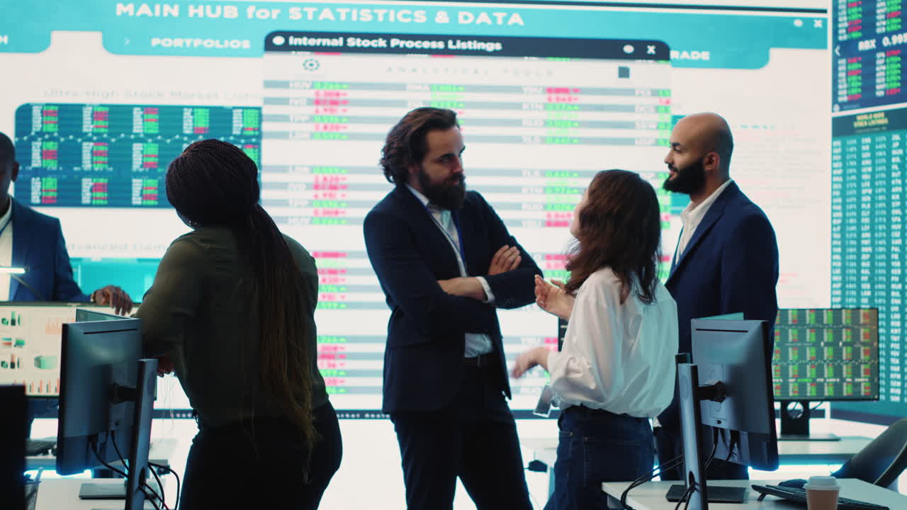 Staff members from a business enterprise discussing details and progress