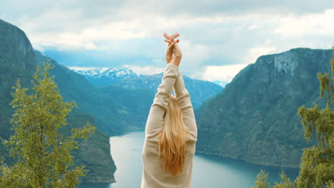 woman enjoying the view of a norwegian fjord