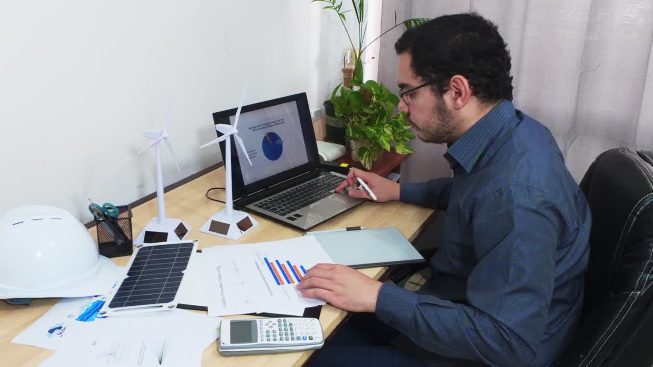 Manager Analyzing Business Data Visualization on a Laptop