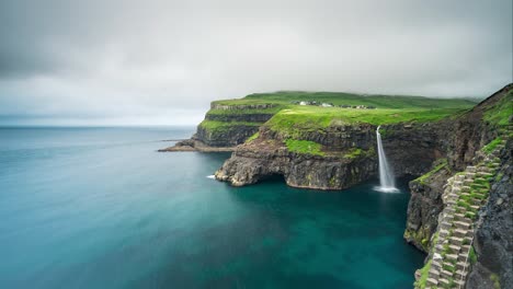 scenic waterfall at faroe island green cliffs motion timelapse