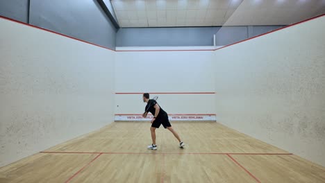 dedicated squash player performing repetitive figure-eight drills on court - 4k