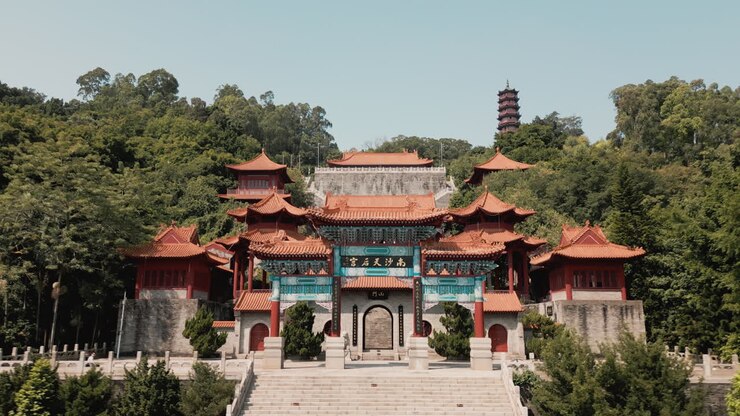 Explore Nansha Tin Hau Palace's divine beauty with an aerial orbit shot of the goddess statue in China
