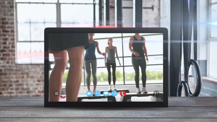 Animation of tablet computer showing a Caucasian women exercising. Coronavirus  spreading