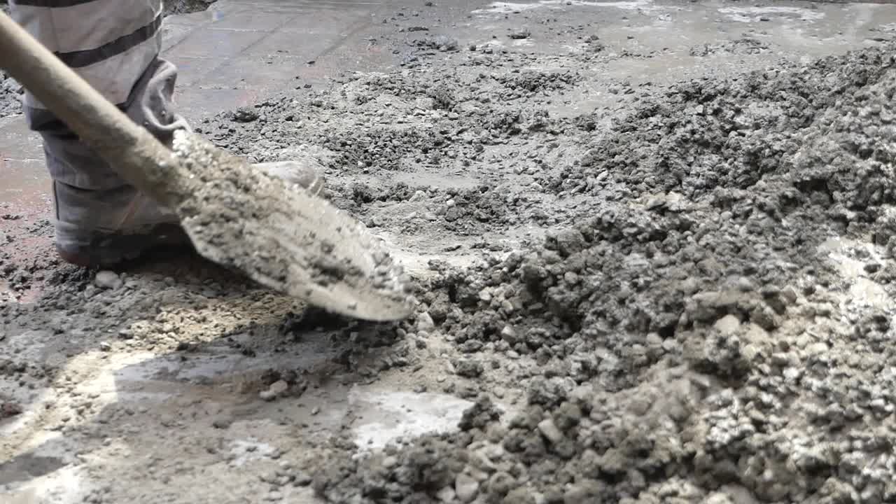Construction site with worker and cement
