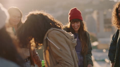 young man dancing multi ethnic friends celebrating on rooftop at sunset enjoying party weekend having fun socializing hanging out drinking