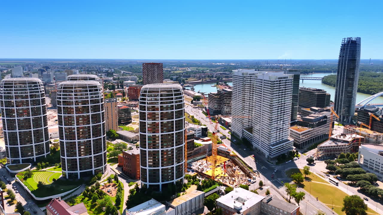 Contemporary high-rise buildings in the cityscape of Bratislava, Slovakia. Sunny scenery of the city from drone