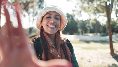 happy woman with braids in bucket hat outdoors