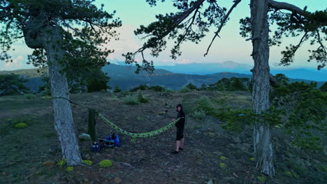 person camping on mount olympus, aerial drone shot