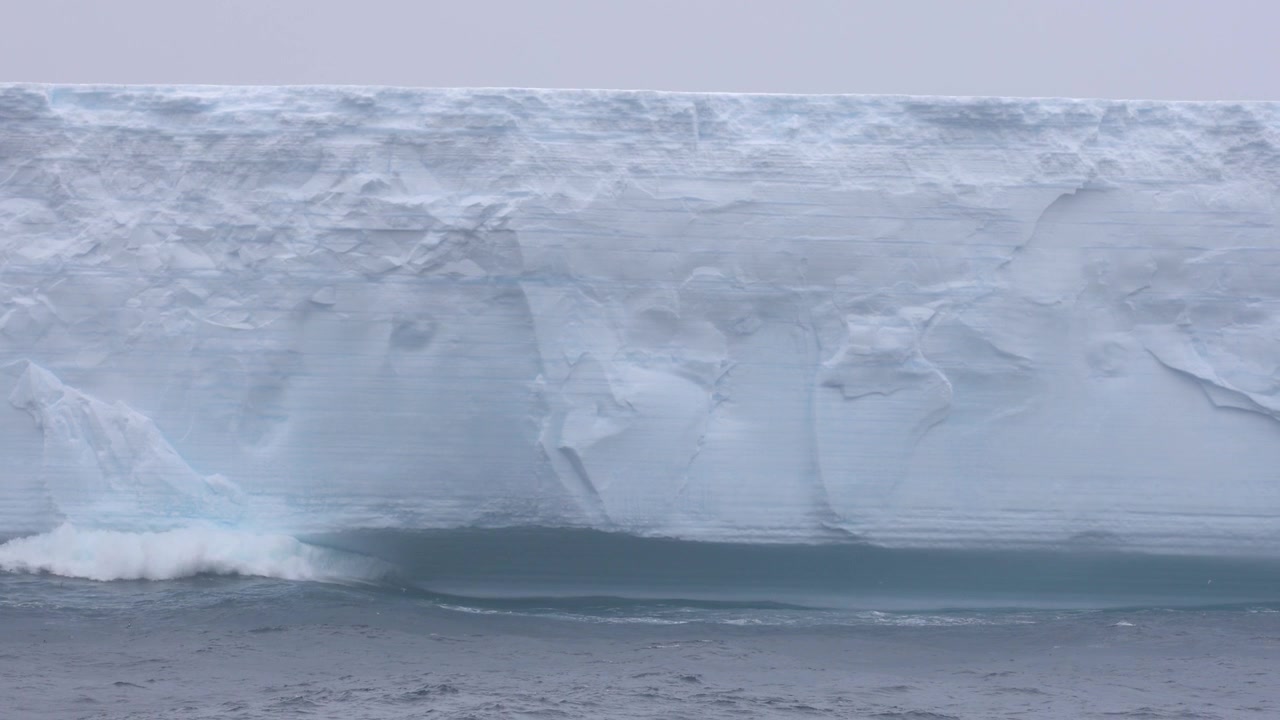 The massive A77 tabular iceberg drifts through the cold open ocean water near South Georgia and the remote sub-Antarctic islands