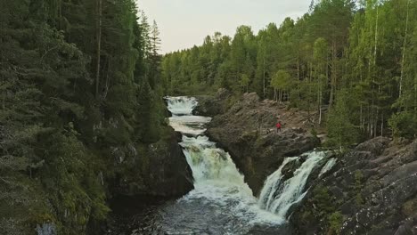 aerial footage of a karelian waterfall kivach, full water stream main view, beautiful nature, foam on water