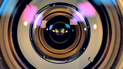 a macro view on a camera lens getting blurred out.