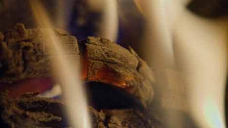 real time shot of flames and embers in a fireplace