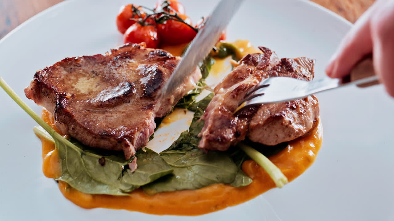 Steak dinner with tomatoes and spinach