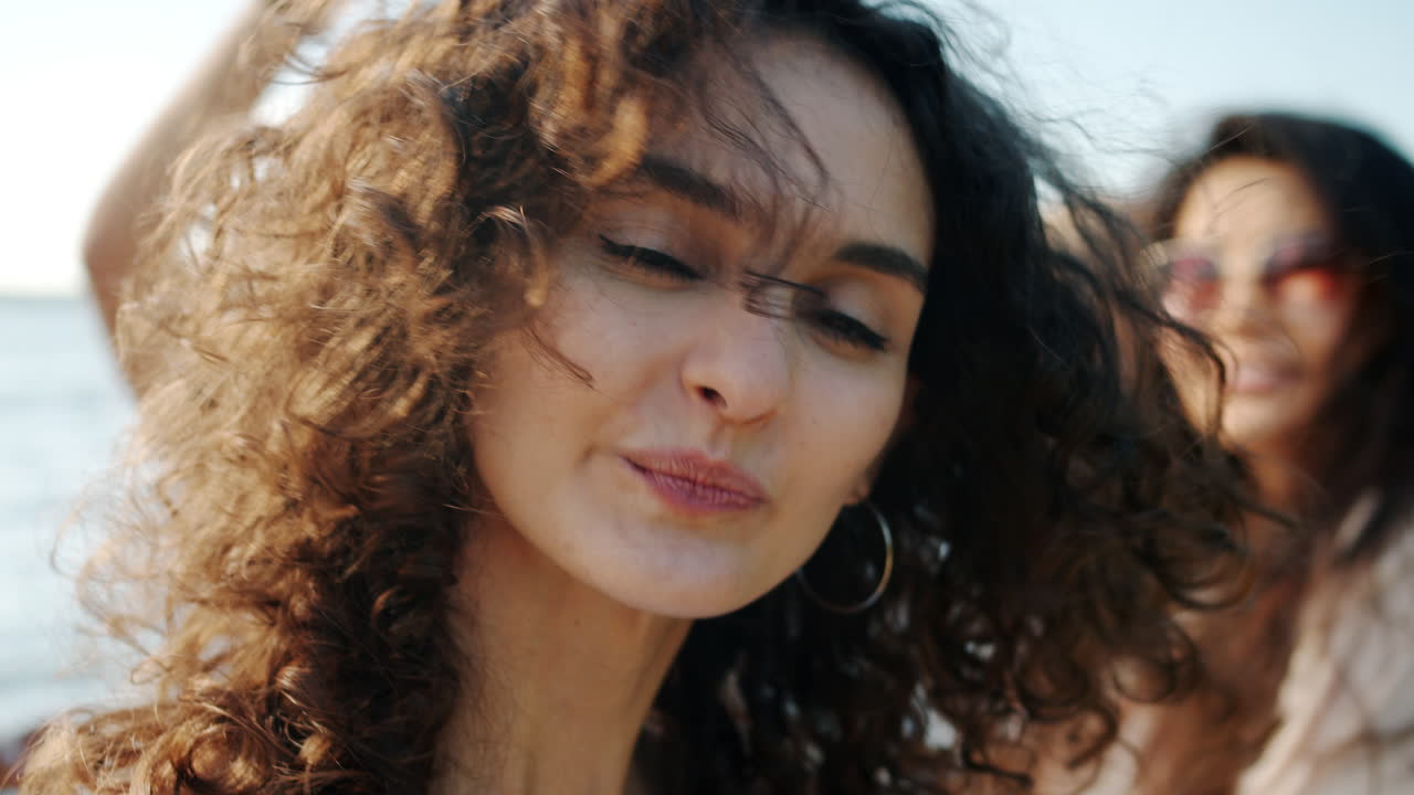 Happy Woman at the Beach with Friends