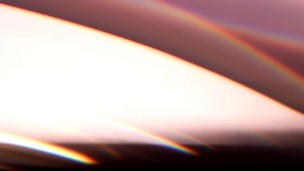 Effetto Flare Lente Arcobaleno e Perdita di Luce su Sfondo Scuro