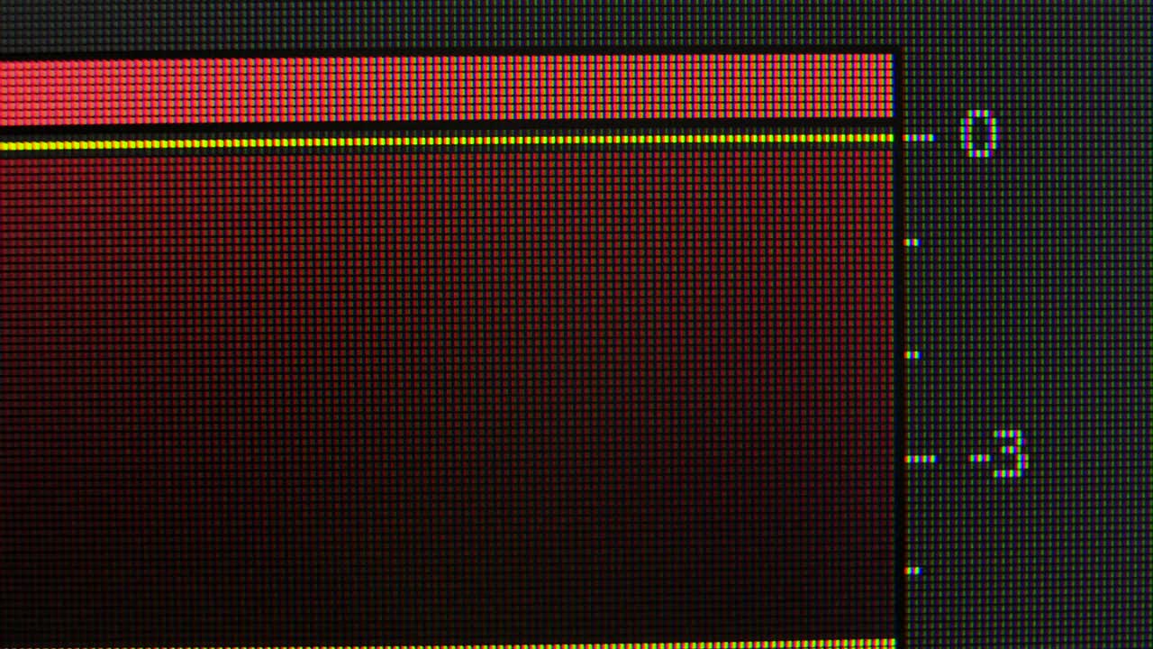 Sound monitor equalizer pixels close up. Red, blue and green subpixels create the image on the screen