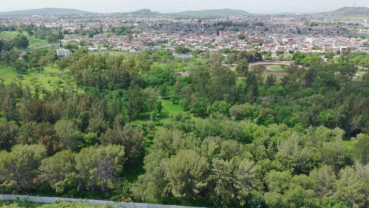 View of the park with many trees, a lung within the city
