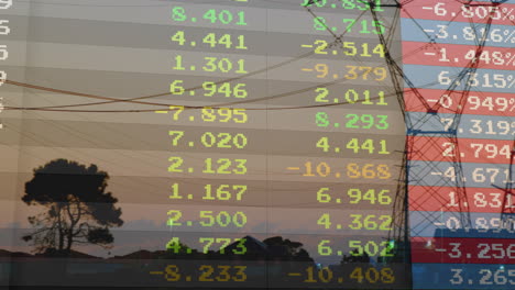 sunset with stock market animation overlaying trees and power lines silhouette