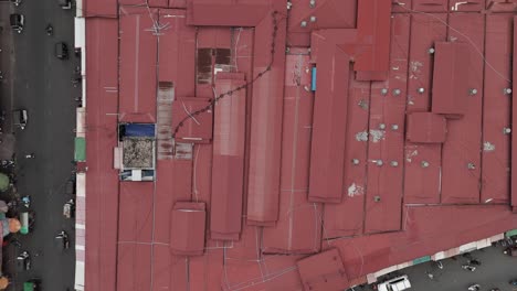 aerial footage in phnom penh city center, cambodia. top down footage above the old market of the capital