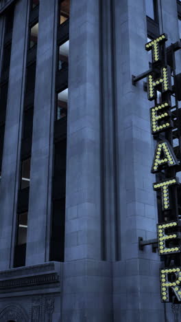 art deco theater building at night