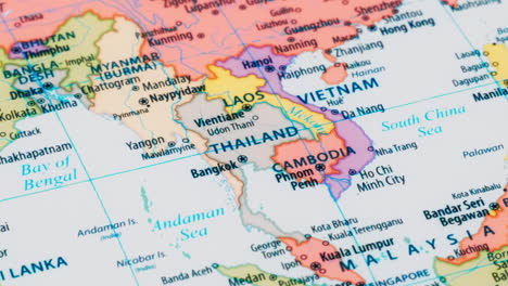 close-up of the country word thailand on a world map with the detailed name of the capital city